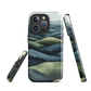 Phone case with layered mountain and forest landscape in blue and green hues
