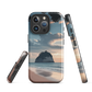 Phone case with Cathedral Cove beach and sunset scene, featuring soft skies and sea stack