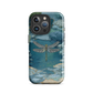 Nature-inspired phone case featuring a dragonfly over calm water with blue and green forest tones.