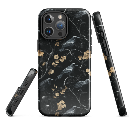 Dark phone case with blackbirds and gold blossoms on black branches.
