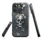 Gothic phone case with a floral skull design in grey tones, featuring white blossoms and dark detailing.
