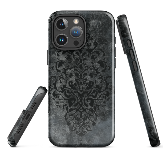Dark damask patterned phone case with a vintage gothic aesthetic and textured stone background.