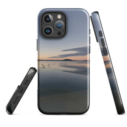Phone case with tranquil lake scene at sunrise and distant hills.