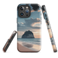 Phone case with Cathedral Cove beach and sunset scene, featuring soft skies and sea stack