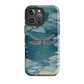 Nature-inspired phone case featuring a dragonfly over calm water with blue and green forest tones.