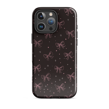 Midnight Bow seamless repeat pattern — pink hand-drawn ribbon bows and sparkle stars on a black background
