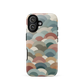 A soft retro-inspired phone case featuring layered arc shapes in warm, earthy tones.