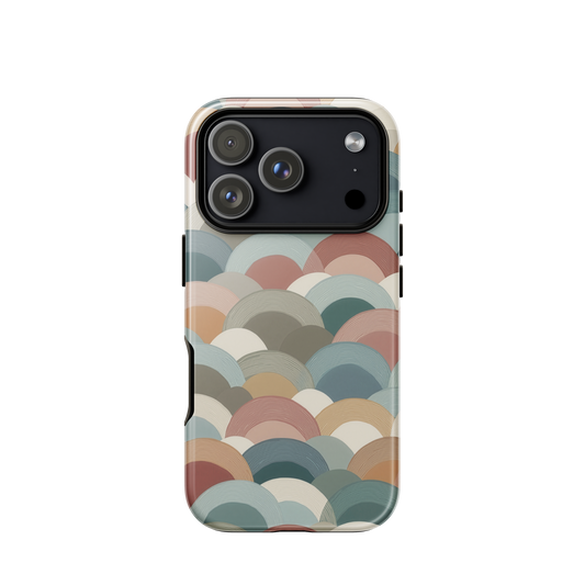 A soft retro-inspired phone case featuring layered arc shapes in warm, earthy tones.