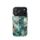 Modern abstract geometric phone case in teal and blue tones with layered retro-inspired shapes.