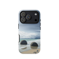 Moeraki Boulders coastal designer phone case with ocean waves and dramatic NZ sky