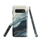 An elegant abstract phone case inspired by layered coastal forms in blue and teal tones.