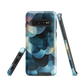 A modern abstract phone case featuring layered blue forms and soft flowing shapes.