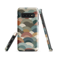 A soft retro-inspired phone case featuring layered arc shapes in warm, earthy tones.