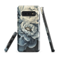 'Whisper' Samsung case features a stunning close-up of softly painted peony blooms in dreamy shades of ivory, grey, and smoky blue.
