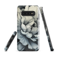 Black and white floral phone case featuring a soft, moody peony design by New Zealand artist Ben Hart.
