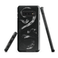 Phone case with detailed black python design on dark background.