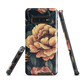Phone case with vintage-style pink roses and bees on dark background, floral New Zealand artwork.