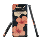 Phone case with coral hibiscus flowers and ivory blooms on dark background