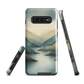 Phone case with soft mountain and valley design in misty green, blue, and golden tones