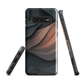 Phone case with flowing abstract design in black, copper and charcoal tones, inspired by dusk shadows