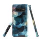 A modern abstract phone case featuring layered blue forms and soft flowing shapes.