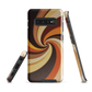 A retro-inspired phone case featuring warm swirling patterns in orange, yellow, and brown tones.