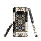 Moroccan tile pattern phone case in black, white, and gold tones with vintage-inspired design.