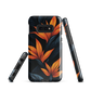 Phone case with bold orange bird of paradise flowers on dark background.