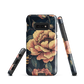 Phone case with vintage-style pink roses and bees on dark background, floral New Zealand artwork.