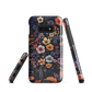 Phone case with colourful wildflowers on dark background, floral art design