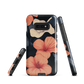 Phone case with coral hibiscus flowers and ivory blooms on dark background