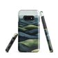 Phone case with layered mountain and forest landscape in blue and green hues