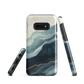 An elegant abstract phone case inspired by layered coastal forms in blue and teal tones.