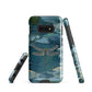 Nature-inspired phone case featuring a dragonfly over calm water with blue and green forest tones.