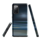 Dark abstract phone case with blue and grey streaks and glossy finish.