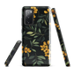 NZ Kowhai phone case with native yellow floral and green leaves on black background by designer Ben Hart.