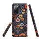 Phone case with colourful wildflowers on dark background, floral art design