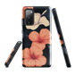Phone case with coral hibiscus flowers and ivory blooms on dark background