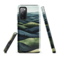 Phone case with layered mountain and forest landscape in blue and green hues