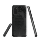 Black embossed damask phone case with gothic baroque pattern.