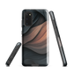 Phone case with flowing abstract design in black, copper and charcoal tones, inspired by dusk shadows
