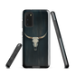 Longhorn skull set against a dark, textured backdrop - protective phone case.