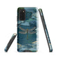 Nature-inspired phone case featuring a dragonfly over calm water with blue and green forest tones.