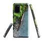 Resting Place phone case with aerial artwork of river rocks, green bush, and driftwood in a New Zealand stream.