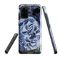 Designer phone case with a bold blue rose artwork and glossy finish.
