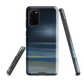 Dark abstract phone case with blue and grey streaks and glossy finish.