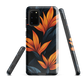 Phone case with bold orange bird of paradise flowers on dark background.