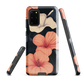 Phone case with coral hibiscus flowers and ivory blooms on dark background