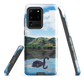 Phone case with a black swan on a calm lake, New Zealand hills in the background. Art by NZ designer Ben Hart.