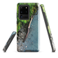 Resting Place phone case with aerial artwork of river rocks, green bush, and driftwood in a New Zealand stream.